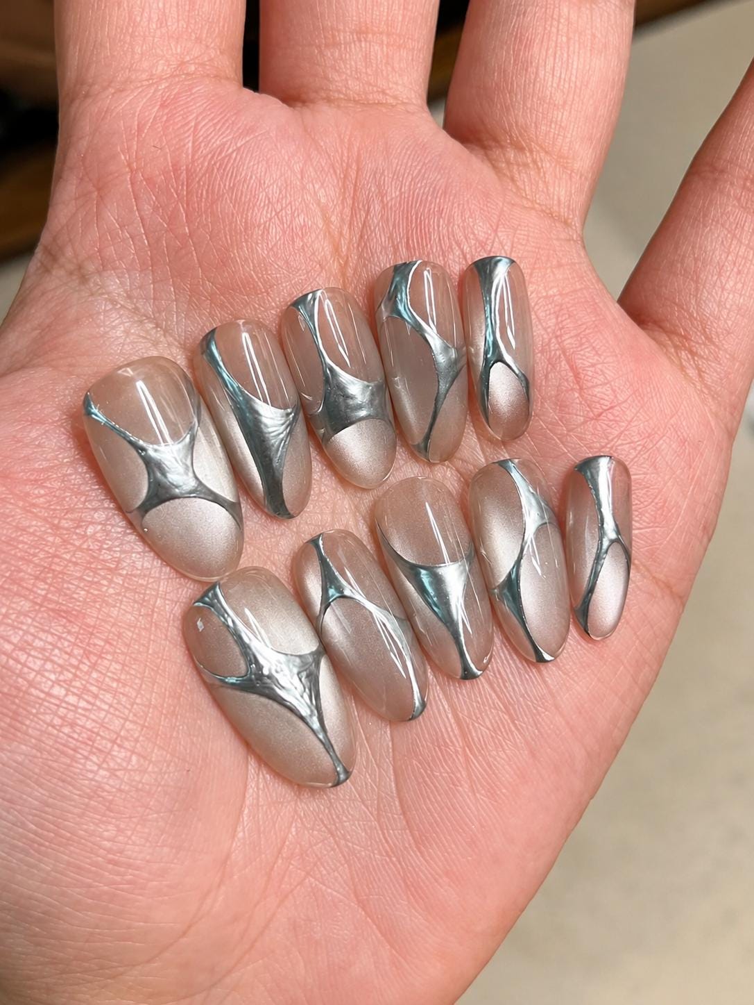 Silver Chrome Press-On Nails – Abstract 3D Metallic Almond – Clear Nude Chrome Swirl