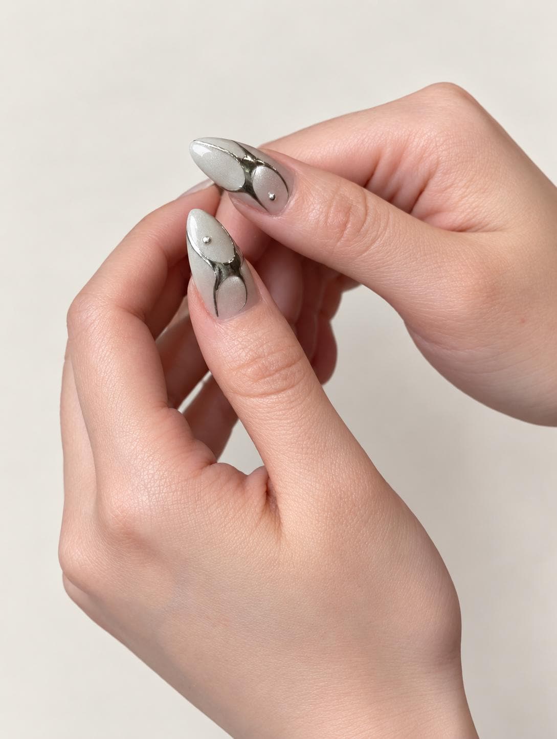 Silver Chrome Press-On Nails – White Almond – 3D Metallic Abstract Details