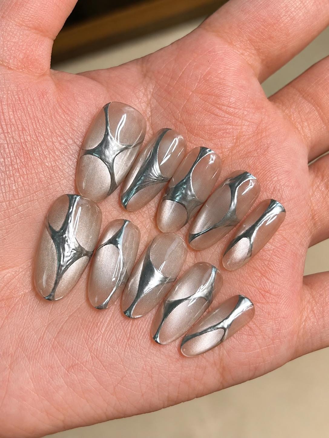 Silver Chrome Press-On Nails – Abstract 3D Metallic Almond – Clear Nude Chrome Swirl